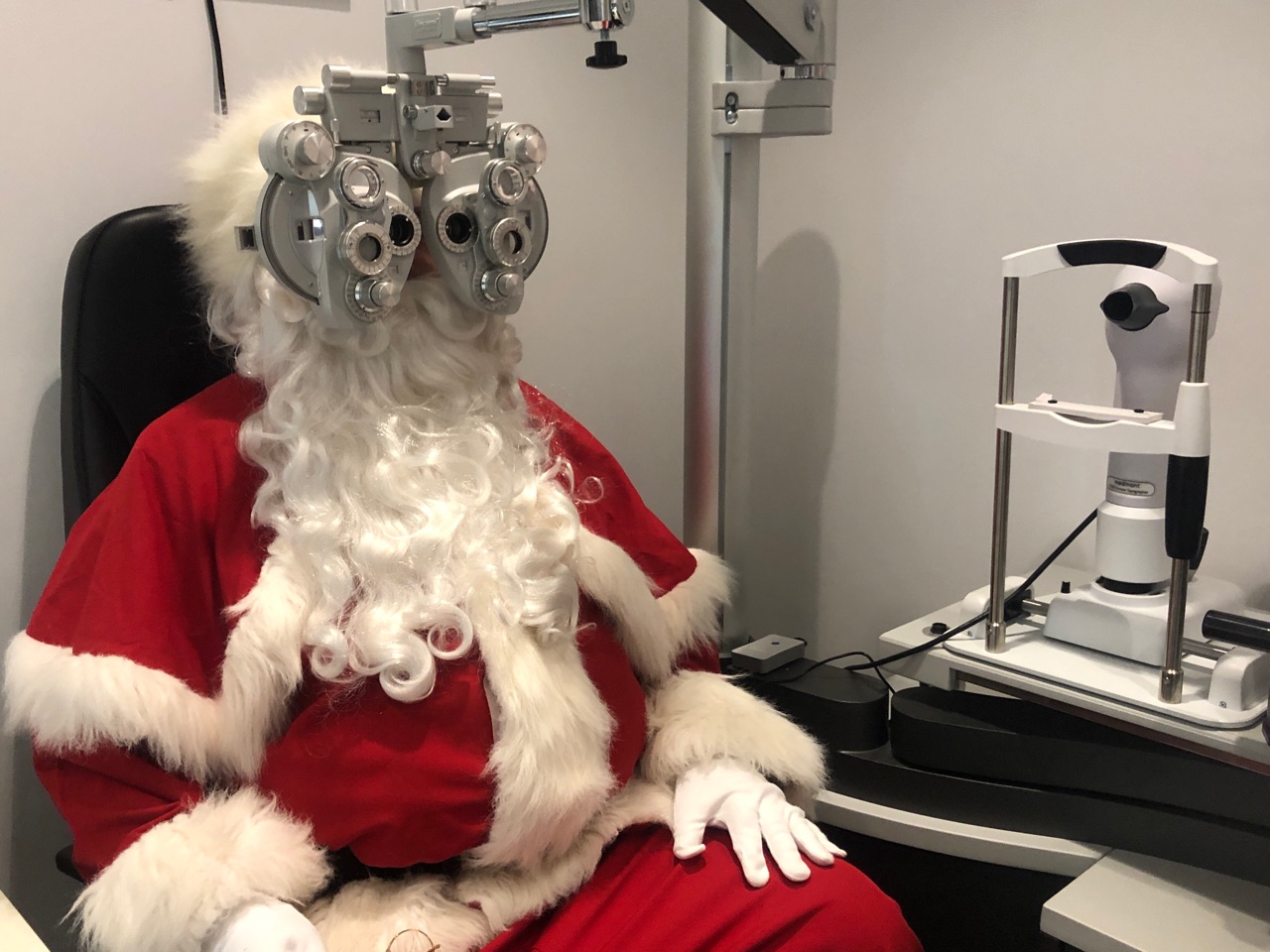 Santa looking through a phoropter (ahhh, so that’s what it’s called!)